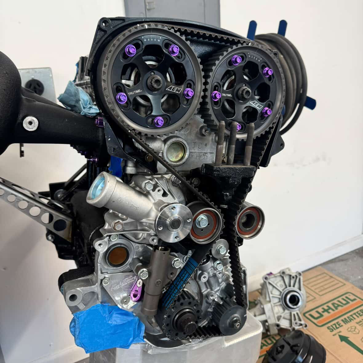 Purple JDC Titanium bolts and washers on a set of AEM cam gears.