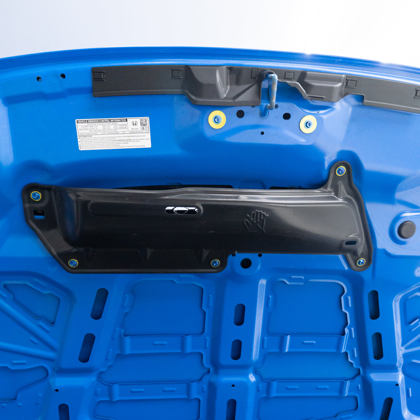 Blue Honda Type-R showing the air scoop heat shield under the hood with blue and gold titanium hardware.