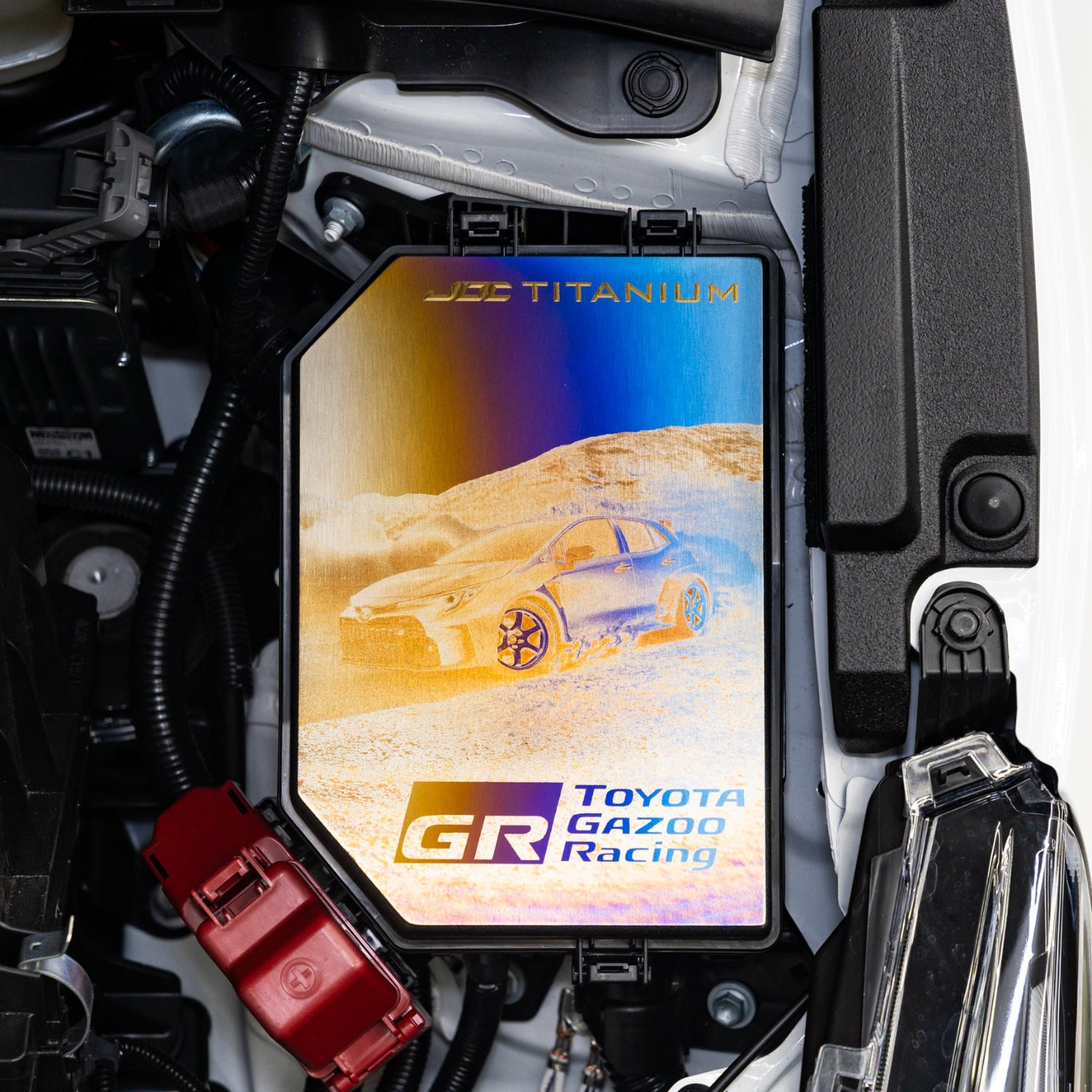 Toyota Gazoo Racing titanium fuse box cover with a car illustration.