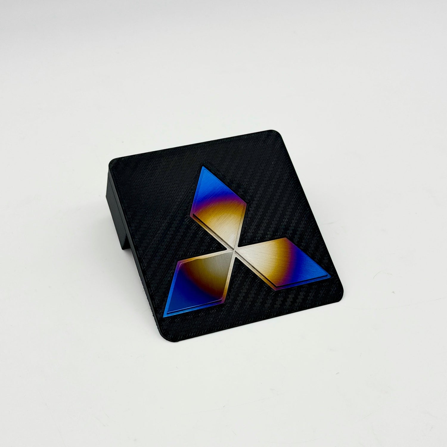 Carbon fiber printed 3D JDC Ashtray Delete with a Mitsubishi diamond star logo in burnt titanium.