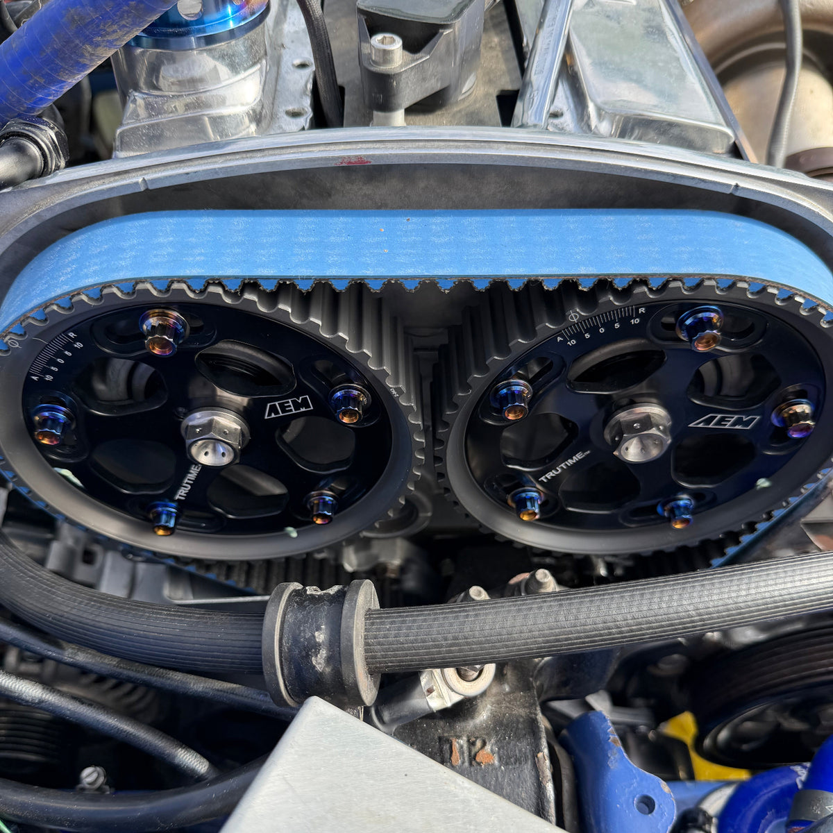 JDC Titanium hardware in a burnt gradient finish installed on an AEM Cam Gear.