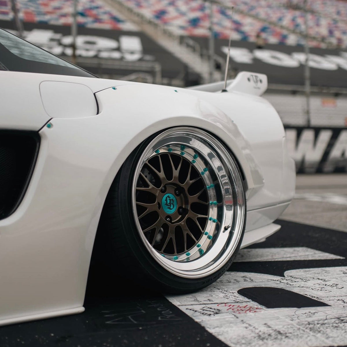 JDC Titanium wide body hardware in an anodized teal color installed on an Acura NSX