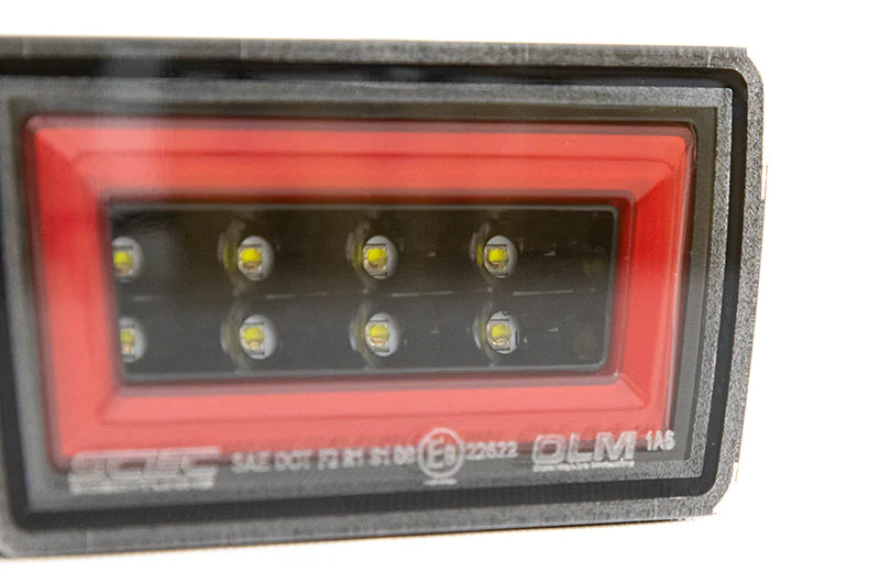 OLM F1 NB+R V2 (lente transparente, base negra brillante, barra roja) - 2022 WRX