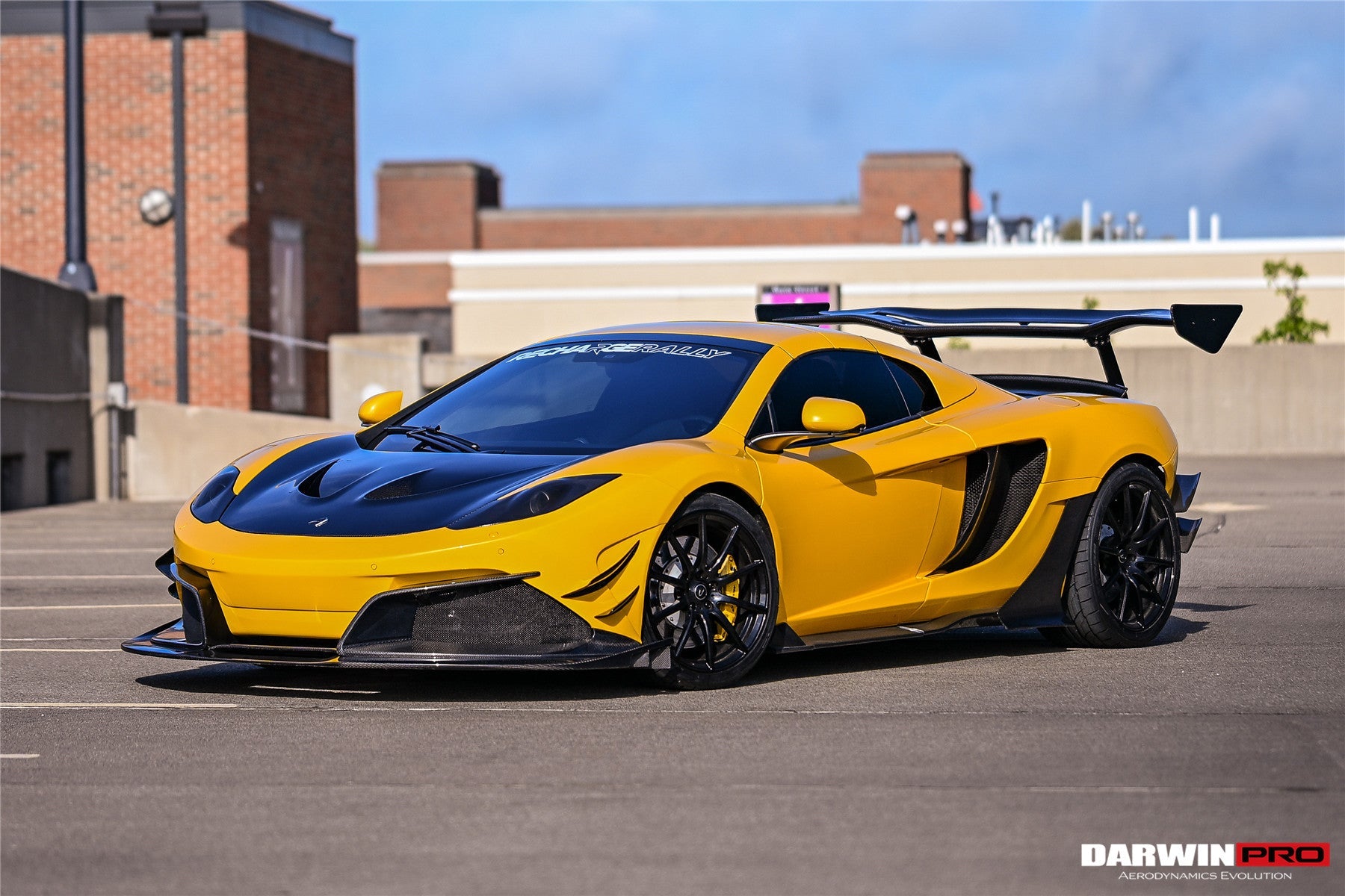 Parachoques delantero DarwinPRO Rebel Performance Style de fibra de carbono parcial con borde | McLaren MP4, 12C (2011-2014)