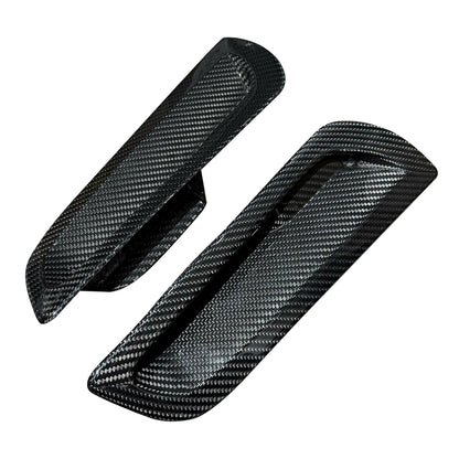 Two carbon fiber panels on a white background
