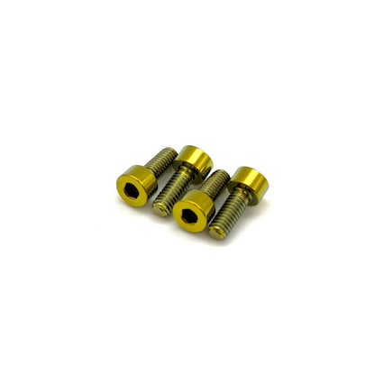 Gold titanium MAF sensor hardware for Nissan GT-R on a white background