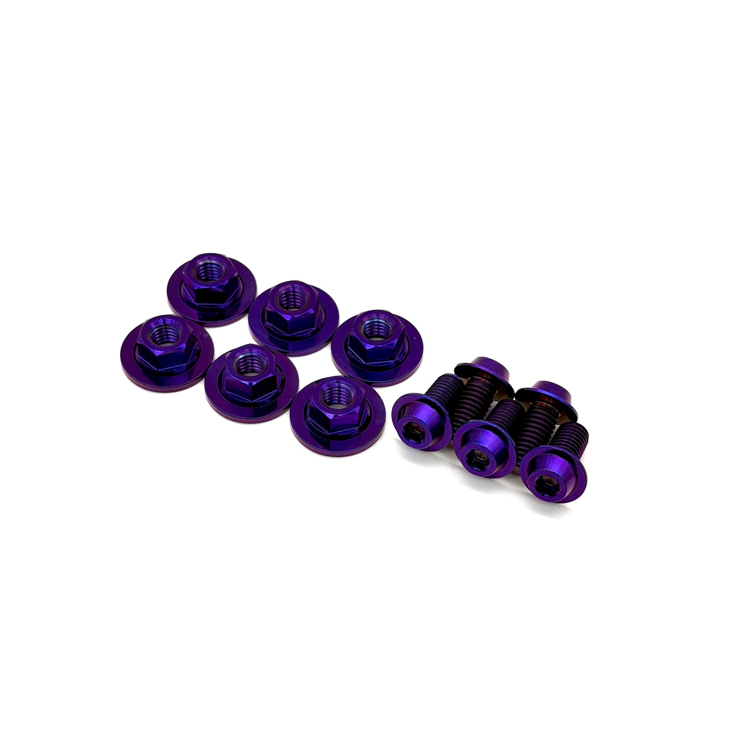purple titanium nuts washers and bolts on a white background