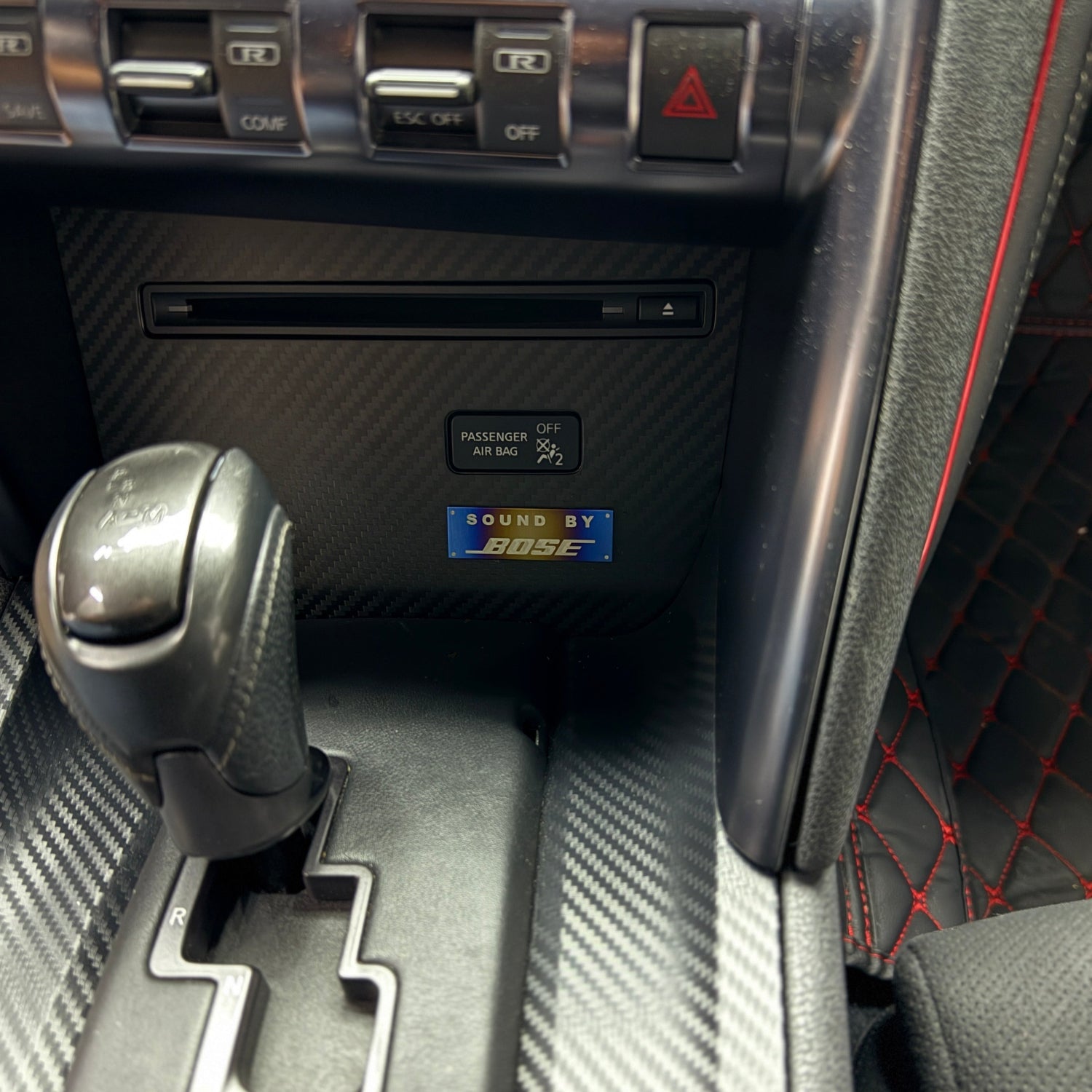Car interior with gear shift and control panel