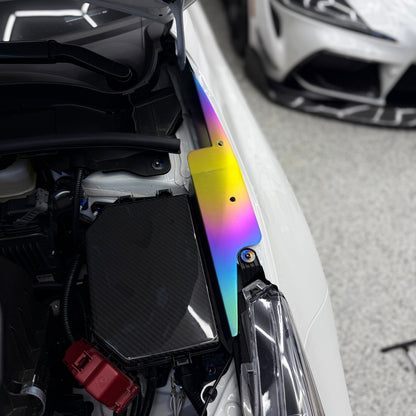 JDC Titanium fender shroud for 2023-2025 Toyota GR Corolla in a Freaktanium gradient finish installed on a white GR Corolla.