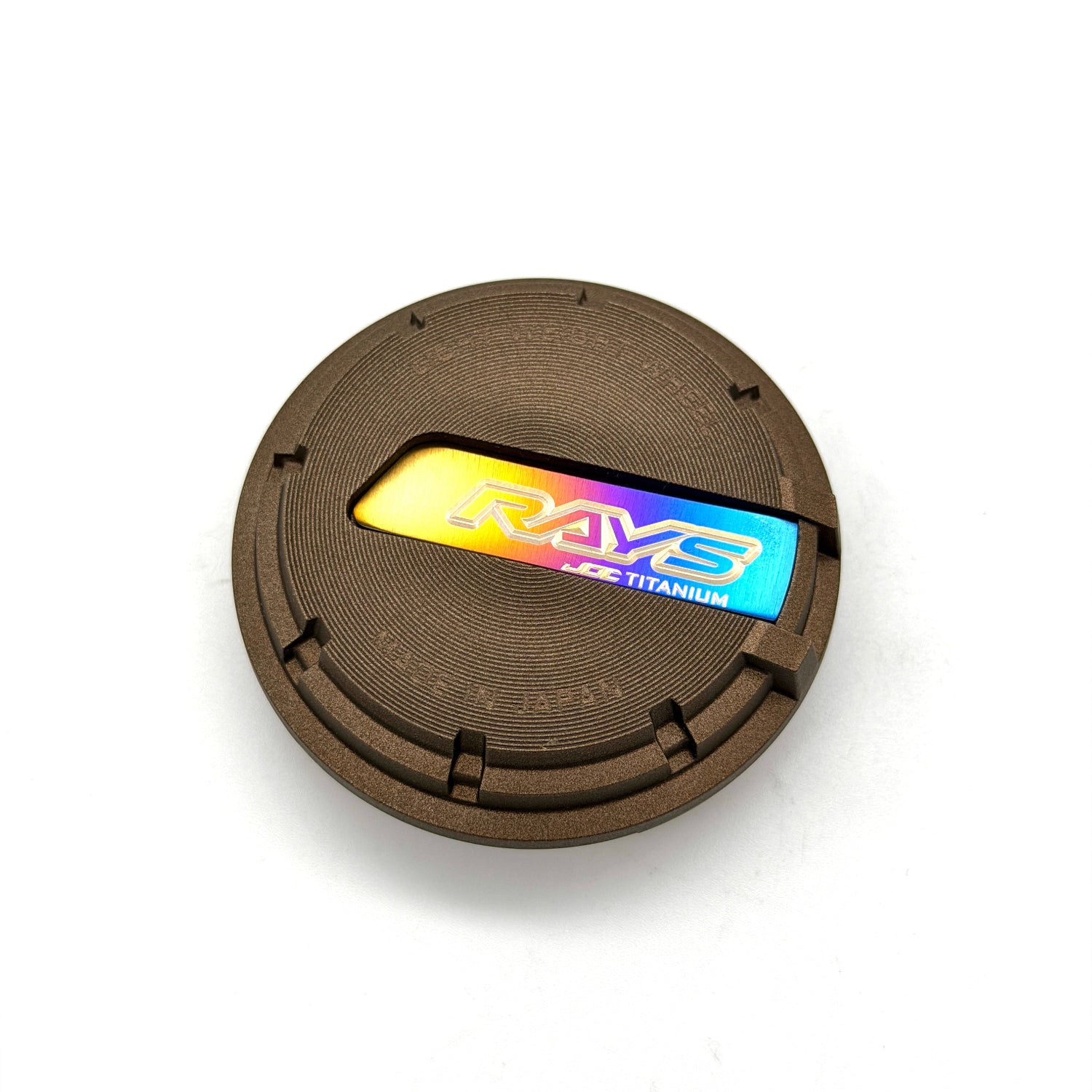Rays wheel center cap with JDC Titanium plaque insert finished in a burnt gradient anodized color with Rays and JDC Titanium logo.
