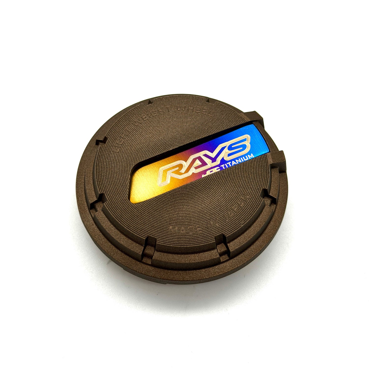 Rays wheel center cap with JDC Titanium plaque insert finished in a burnt gradient anodized color with Rays and JDC Titanium logo.