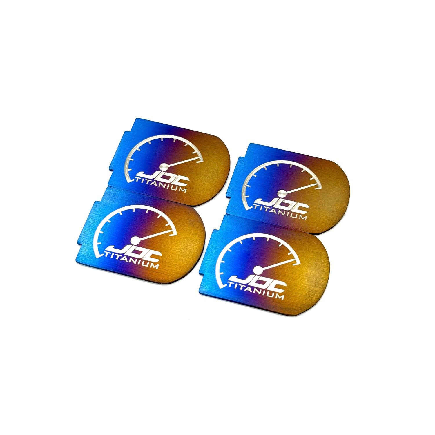 Four JDC Titanium coil plaques on a white background