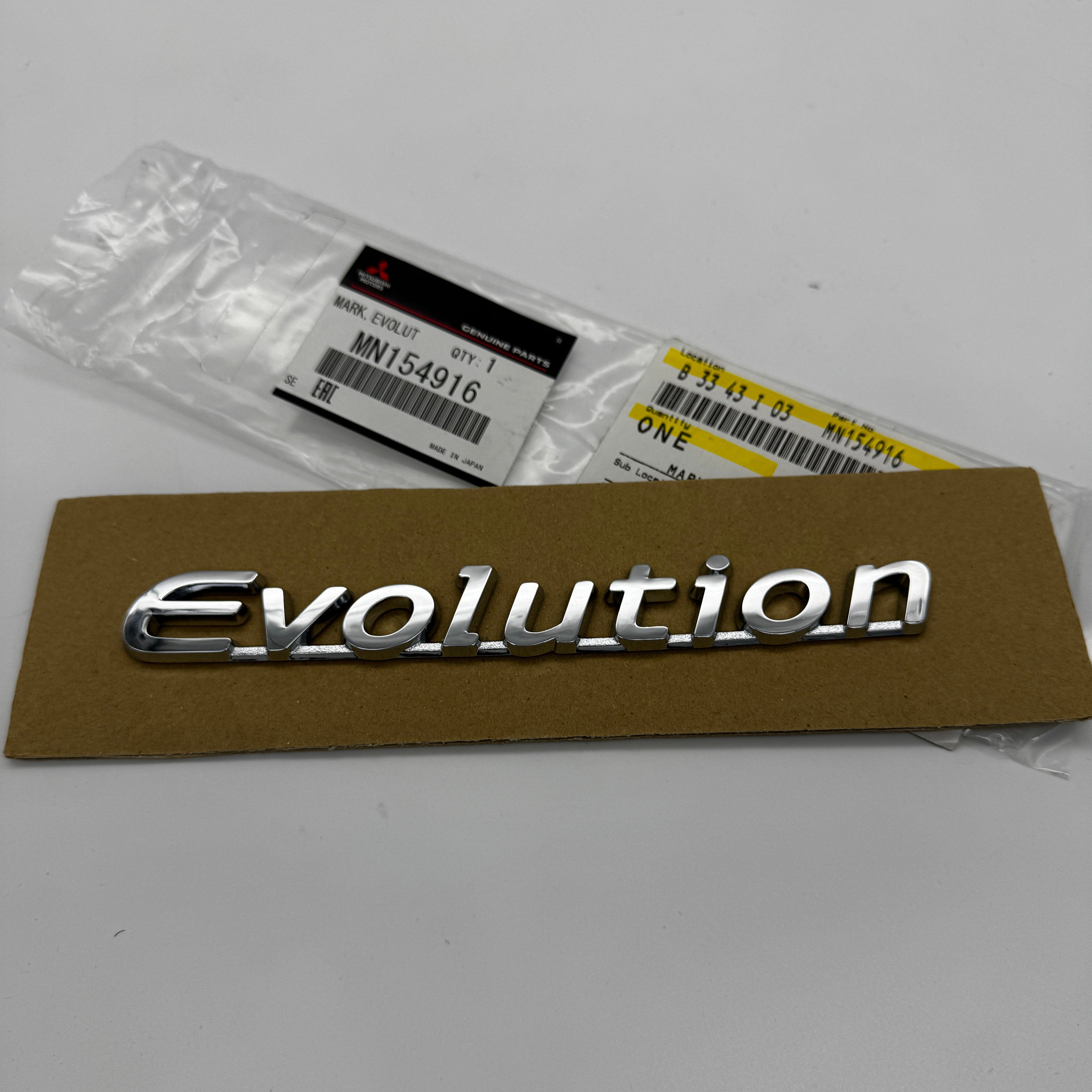 Insignia del maletero OEM Mitsubishi "Evolution" (Evo 7/8/9)