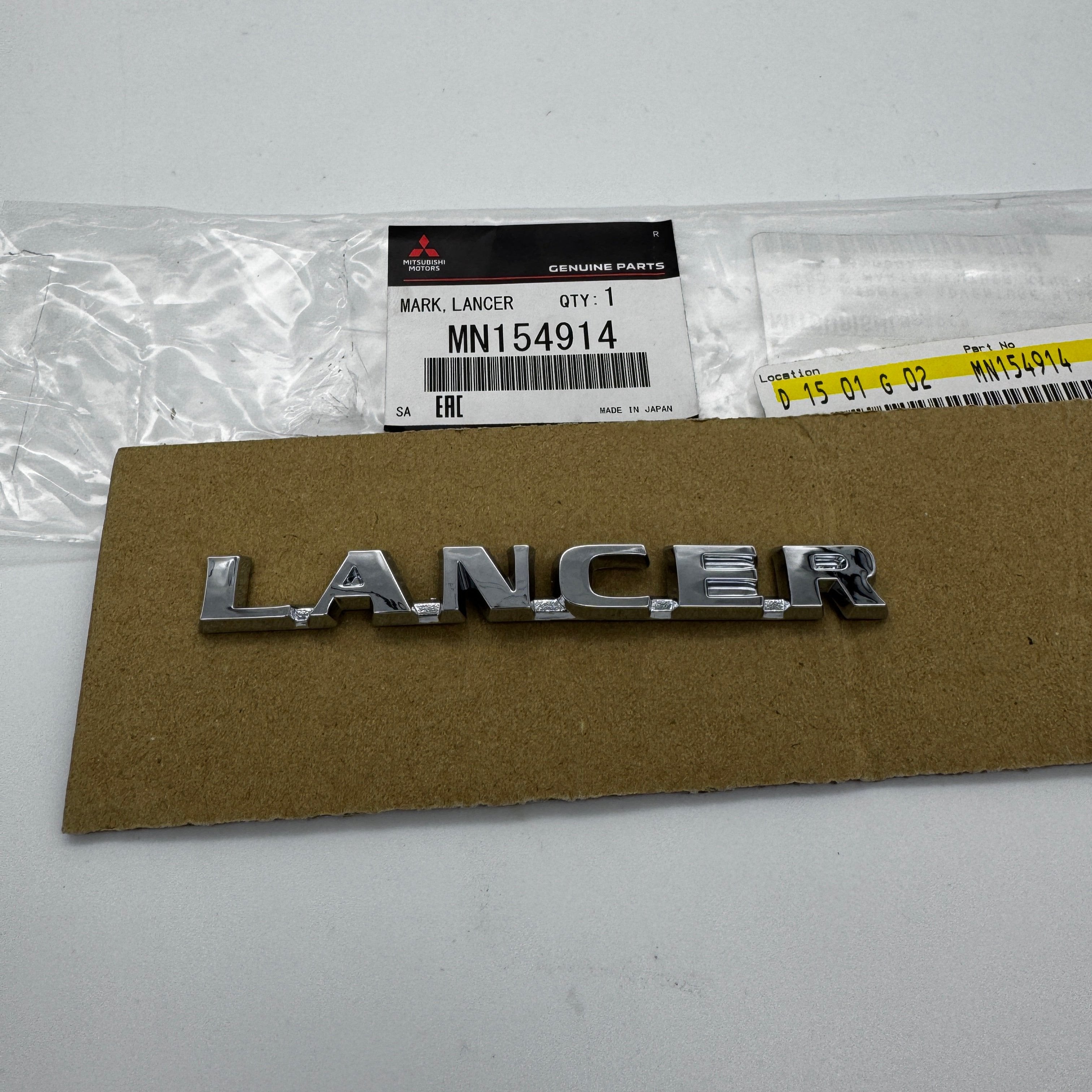 Insignia de maletero OEM Mitsubishi "Lancer" (Evo 7/8/9)