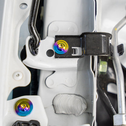 Gradient freaktanium titanium hardware installed on a white Acura Integra A-Spec