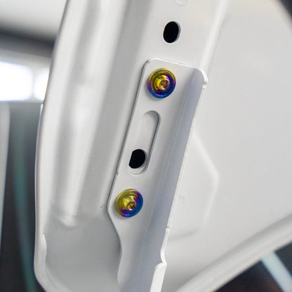 Gradient freaktanium titanium hardware installed on a white Acura Integra A-Spec Hood bracket