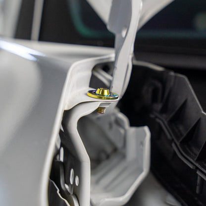 Gradient freaktanium titanium hardware installed on a white Acura Integra A-Spec