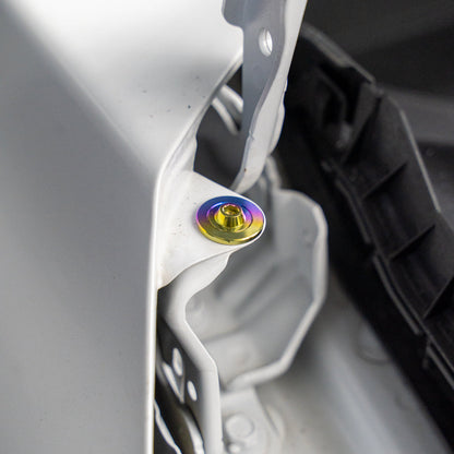 Gradient freaktanium titanium hardware installed on a white Acura Integra A-Spec
