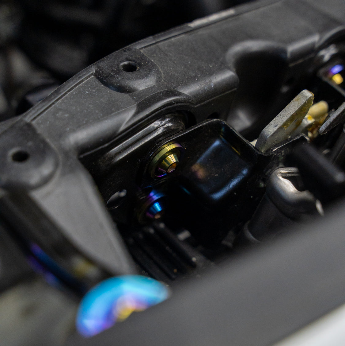 Gradient freaktanium titanium hardware installed on a white Acura Integra A-Spec