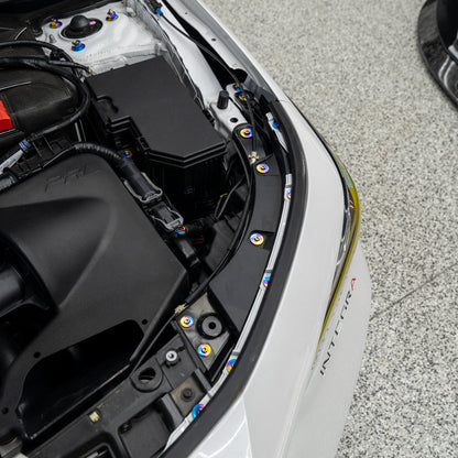 Gradient freaktanium titanium hardware installed on a white Acura Integra A-Spec