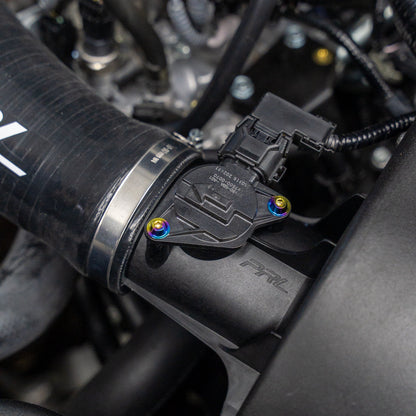 Gradient freaktanium titanium hardware installed on a white Acura Integra A-Spec MAF sensor