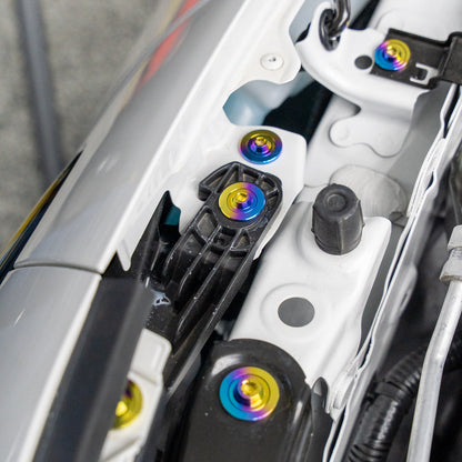 Gradient freaktanium titanium hardware installed on a white Acura Integra A-Spec