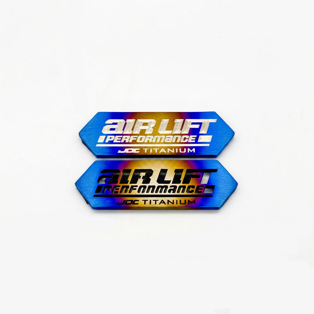 JDC Titanium ALP4 Manifold Badge in a burnt finish with cut-through and laser-etched option Design