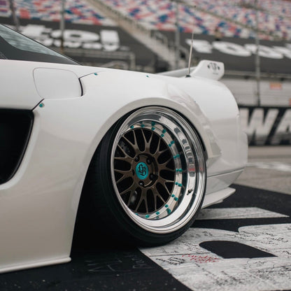 JDC Titanium wide body hardware in an anodized teal color installed on an Acura NSX