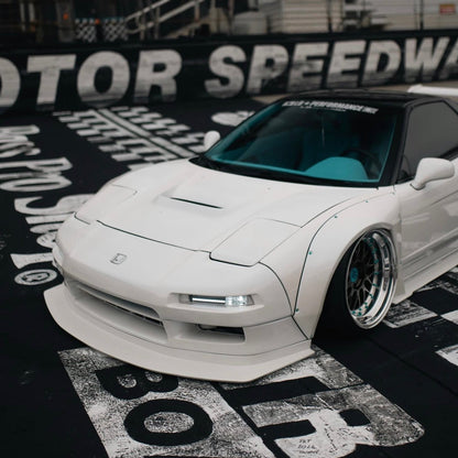 JDC Titanium wide body hardware in an anodized teal color installed on an Acura NSX