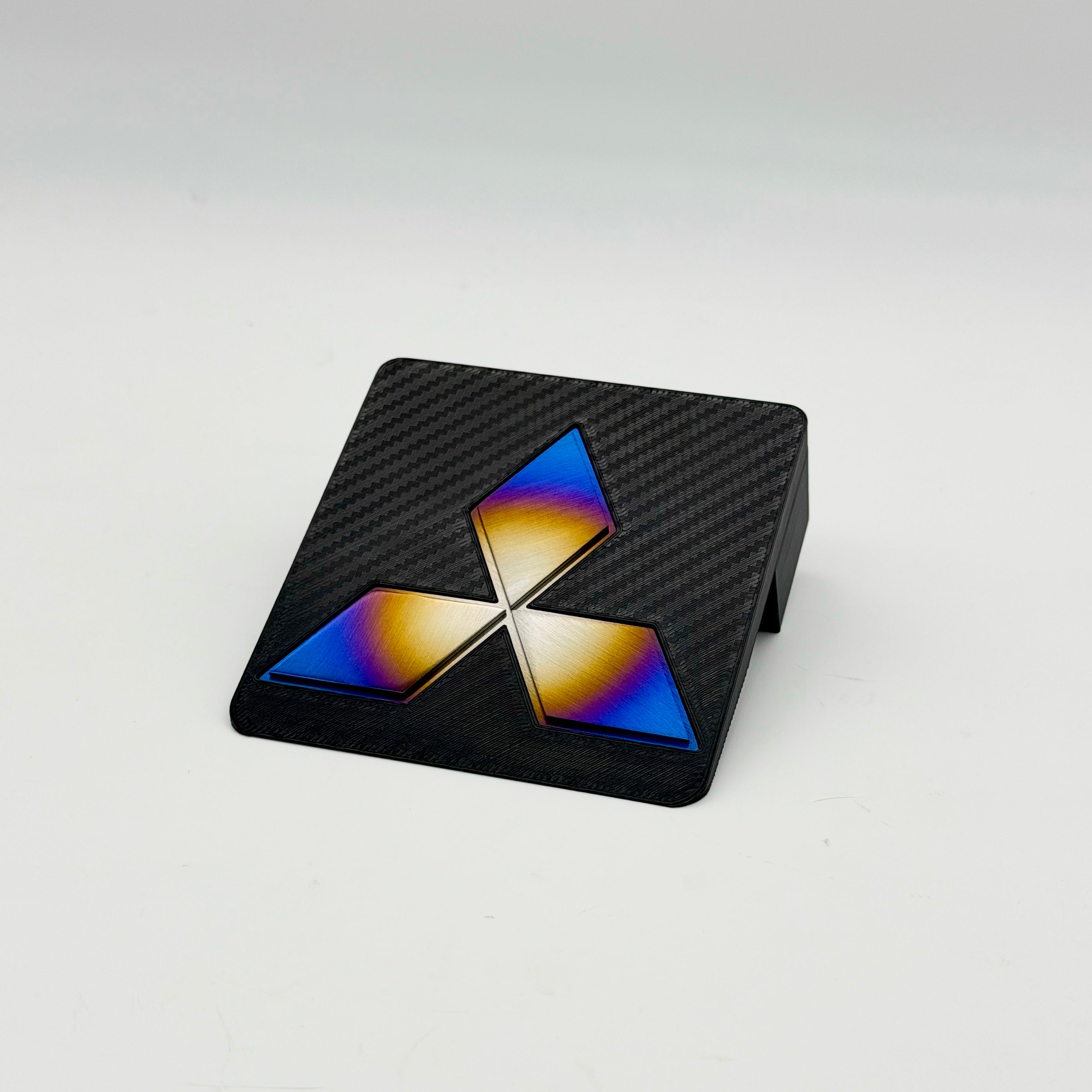 Carbon fiber printed 3D JDC Ashtray Delete with a Mitsubishi diamond star logo in burnt titanium.