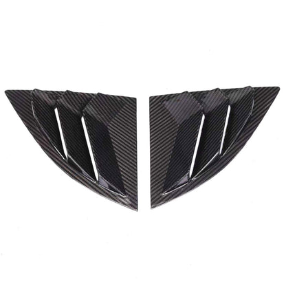 Two carbon fiber car window louvers on a white background