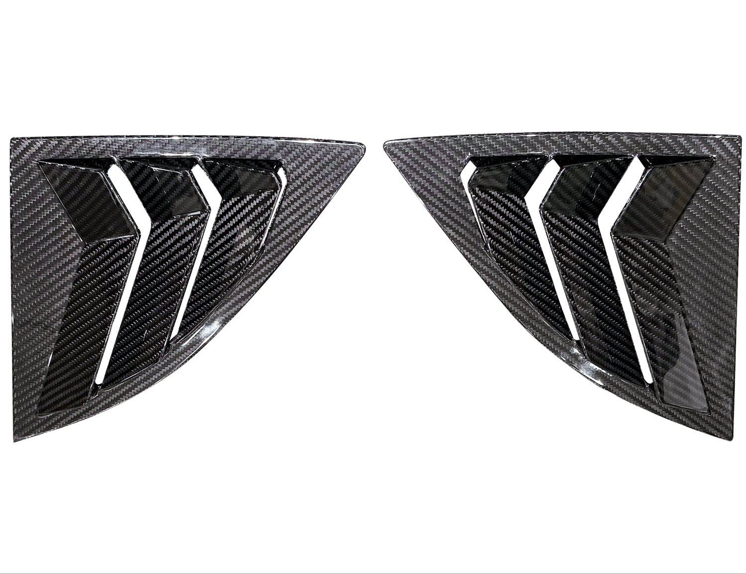 Two carbon fiber car window louvers on a white background