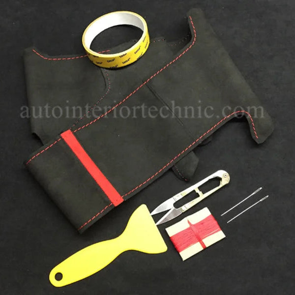 Black leather car dashboard cover with red stitching, measuring tape, knife, and scraper on a black background.