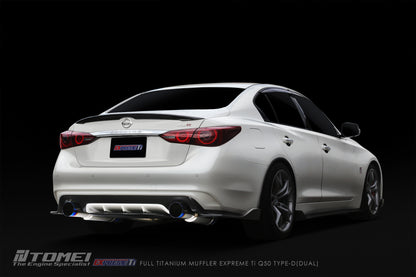 White Infiniti Q60 with a dark background and Tomei dual exhaust system.