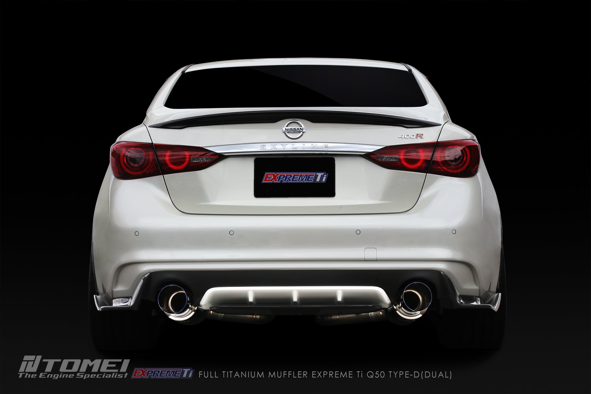 White Infiniti Q60 with a dark background and Tomei dual exhaust system.