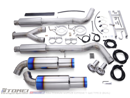 Tomei exhaust system components on a white background